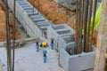 A mason man is laying the mounting a wall of aerated concrete blocks