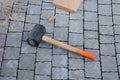 Mason tool for curb stone and brick pavement laying down, rubber mallet. rubber hammer for tile