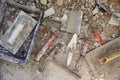 Mason tools on debris background Royalty Free Stock Photo