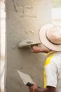 Mason using trowel for plastering the concrete to build wall, Co Royalty Free Stock Photo