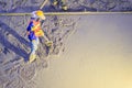 Mason worker leveling concrete with trowels, mason hands spreading poured concrete. Concreting workers are leveling poured liquid