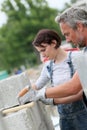 Mason with young woman trainee at work Royalty Free Stock Photo