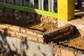 Masoned wall made of red/orange bricks and mortar Royalty Free Stock Photo