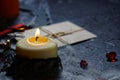 halloween vintage envelope with stamp. burning candles and spiders on the web next to a wooden cross. horizontal