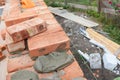 Masonry. Laying brick wall on house construction site with concrete Royalty Free Stock Photo