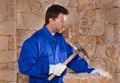 Masonry mason stonecutter man with hammer working Royalty Free Stock Photo