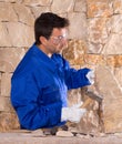 Masonry mason stonecutter man with hammer working