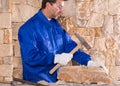 Masonry mason stonecutter man with hammer working Royalty Free Stock Photo