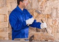 Masonry mason stonecutter man with hammer working Royalty Free Stock Photo