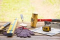 Masonry tool background such as glove and tape measure and sledgehammer with trowel and level and etc.Background craftsman tool Royalty Free Stock Photo