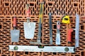 Masonry tools on a red brick. Royalty Free Stock Photo