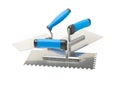 Masonry tools - trowels and notched trowel - on white Royalty Free Stock Photo