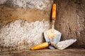 Masonry trowels on a concrete wall