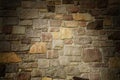 Masonry Wall of Multicolored Stone Lit Dramatically