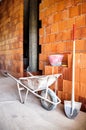 Masonry, wheelbarrow, bricks and shovel Royalty Free Stock Photo