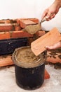 Masonry worker hands closeup