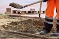 masons sand throw shovels for laying paving slabs in the town square Royalty Free Stock Photo