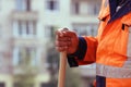 masons in the town square laid paving slabs. worker stands with a shovel Royalty Free Stock Photo