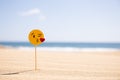 MASPALOMAS, GRAN CANARIA - OCTOBER, 2019: Emoji Blowing Kiss On Stick On Sandy Beach At Sunny Day