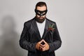 Masquerade ball, concentrated bearded man in