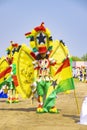 Masquerade and fancily dressed festival participant with Ghana flag dudring a festival Royalty Free Stock Photo