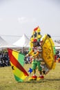 Masquerade and fancily dressed festival participant with Ghana flag dudring a festival Royalty Free Stock Photo