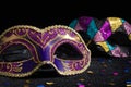 Masquerade mask with confetties on black background