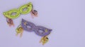 Masquerade masks on a purple background