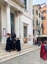 masquerading tourist in front of Fenice opera Royalty Free Stock Photo