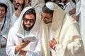 Mass prayer. Hasids pilgrims in traditional clothes. Tallith - jewish prayer shawl. Rosh Hashanah, Jewish New Year.