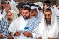 Mass prayer. Hasids pilgrims in traditional clothes. Tallith - jewish prayer shawl. Rosh Hashanah, Jewish New Year.