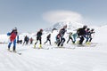 Mass start race, ski mountaineers climb on skis on mountain. Team Race ski mountaineering. Russia, Kamchatka