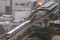 Mass transit BTS sky train running to Siam station with air pollution effect made low visibility during sunset