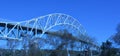 Sagamore Bridge over Cape Cod Canal under bright blue skies