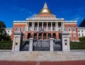 Massachusetts State House or Capitol Building, in central Boston, with its red brick facade and golden dome or cupola against a Royalty Free Stock Photo