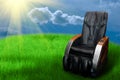 Massage arm-chair on the grass field Royalty Free Stock Photo