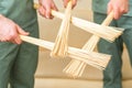 Massage bamboo brooms in hands