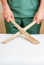 Massage bamboo brooms in hands