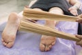 Massage with bamboo sticks of feet. A relaxing and invigorating Brazilian Creole massage. Lymphatic drainage massage with thin
