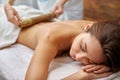 Massage with bamboo sticks Royalty Free Stock Photo