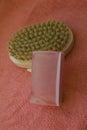 Massage brush and pink soap