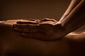 Massage closeup with hands of professional masseur