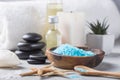 SPA concept: composition of spa treatment with natural sea salt, aromatic oil and flowers on wooden background, close up, top view Royalty Free Stock Photo