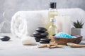 SPA concept: composition of spa treatment with natural sea salt, aromatic oil and flowers on wooden background, close up, top view Royalty Free Stock Photo