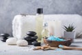Massage. Composition with candles, spa stones and salt on concrete background. Spa and wellness setting ready for beauty treatment Royalty Free Stock Photo
