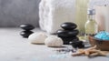 Massage. Composition with candles, spa stones and salt on concrete background. Spa and wellness setting ready for beauty treatment Royalty Free Stock Photo