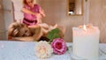 Massage concept. Beautiful young woman reciving relaxing massage at spa salon Royalty Free Stock Photo