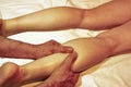 Massage of the female foot, hands of the masseur of the man