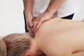 Osteopath does back and shoulder massage to a girl Royalty Free Stock Photo