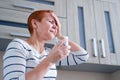 Massage his temples. A woman suffering from a headache. Health problems,. Woman holding her head with her hand Royalty Free Stock Photo